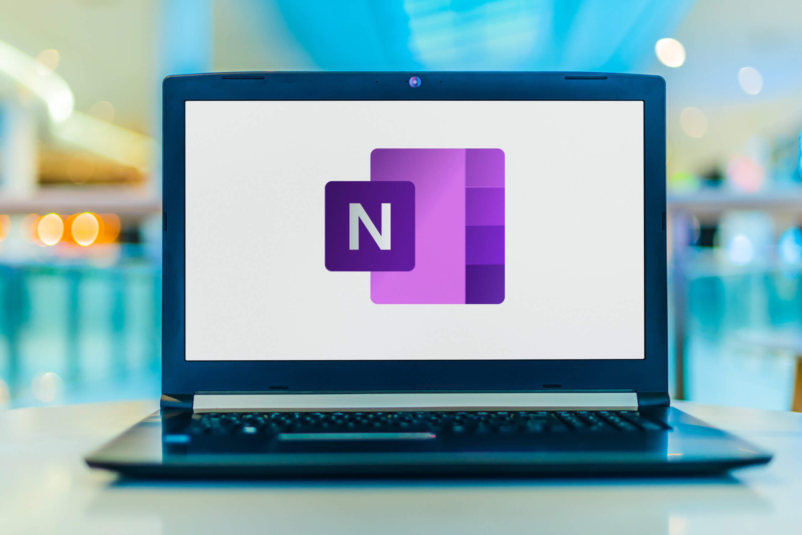 Laptop computer displaying logo of Microsoft OneNote